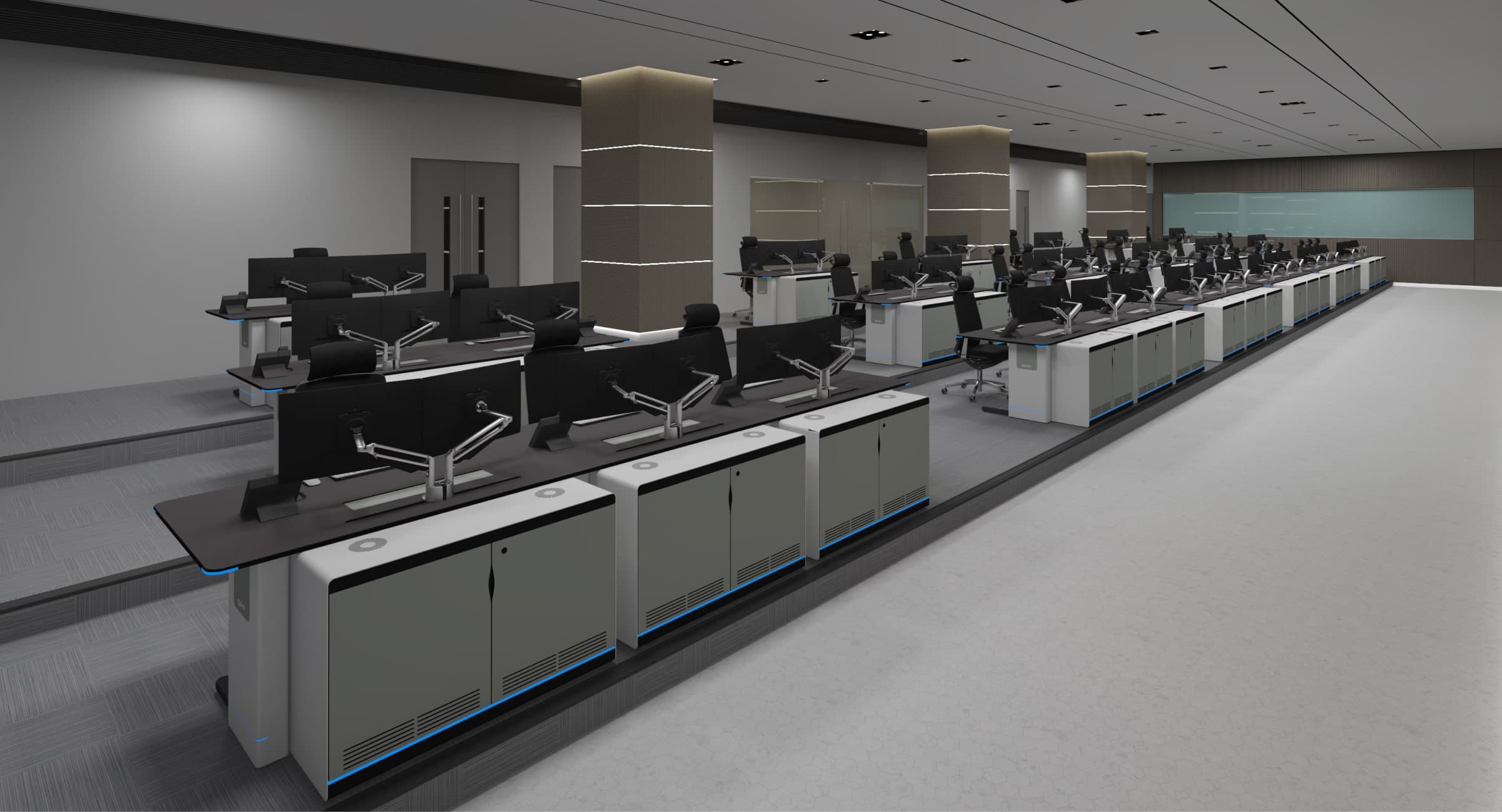 Control room consoles with integrated under-desk storage cabinets in a long monitoring center
