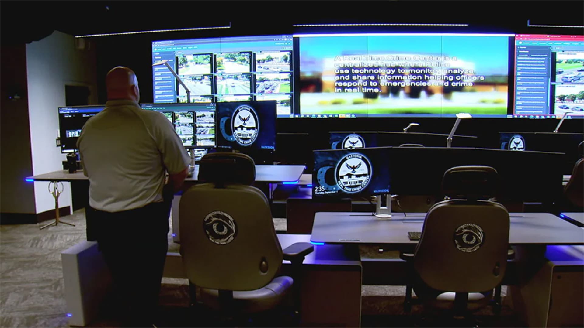 Gastonia Police real-time crime center with an operator monitoring live feeds on a video wall
