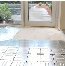 Threshold edge of raised access floor system meeting surrounding slab and doorway